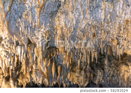 Ancient cave with stalactites and stalagmites Ancient cave with stalactites and stalagmites 58291024