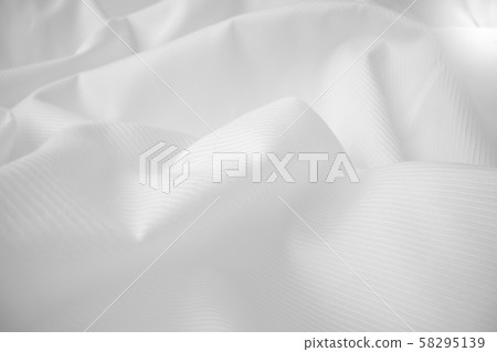 Shiny flowing cloth texture in macro shot. Shiny flowing cloth texture in macro shot. 58295139