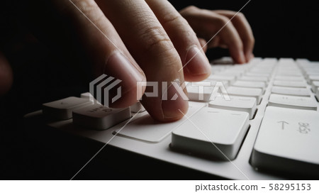 Close-up soft-focus finger typing on keyboard. Close-up soft-focus finger typing on keyboard. 58295153