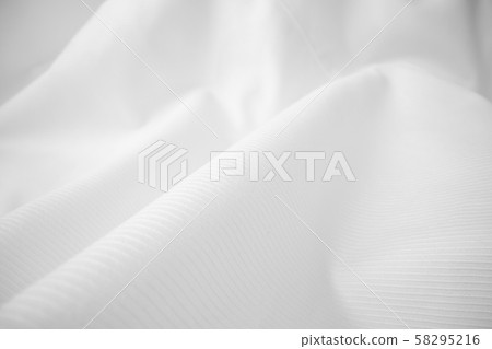 Shiny flowing cloth texture in macro shot. 58295216