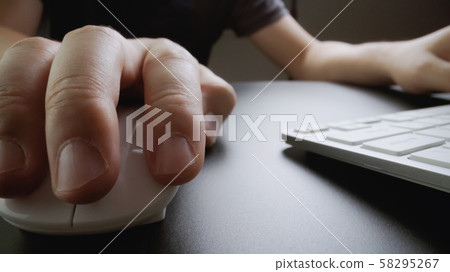 Close-up soft-focus finger typing on keyboard. Close-up soft-focus finger typing on keyboard. 58295267