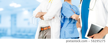 Doctor working in hospital with other doctors. Doctor working in hospital with other doctors. 58295275