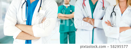 Doctor working in hospital with other doctors. Doctor working in hospital with other doctors. 58295577