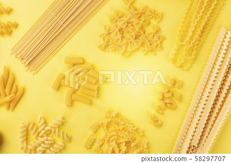Italian pasta, flat lay banner with copy space, a top shot on a yellow background, a design template 58297707
