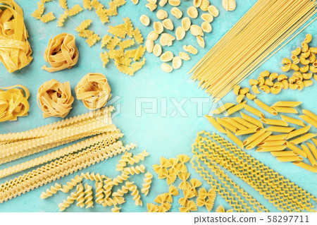 Italian pasta, flat lay banner with copy space, an overhead shot on a teal blue background, a design 58297711