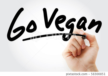 Hand writing Go Vegan text with marker 58300851