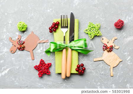 New year set of fork and knife on napkin. Top view New year set of fork and knife on napkin. Top view 58301998