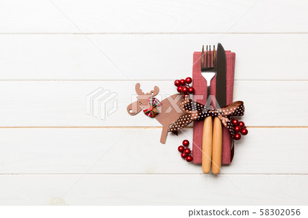 New year set of fork and knife on napkin. Top view New year set of fork and knife on napkin. Top view 58302056