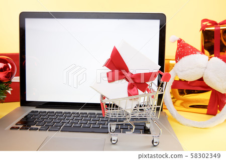 Tula, 28 09 19: shopping online concept. Credit card and laptop with christmas gifts and boxes. 58302349