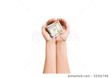 Top view of dollars in female palms on white Top view of dollars in female palms on white 58302746