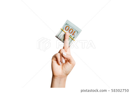 Female hand giving money on white isolated 58302750