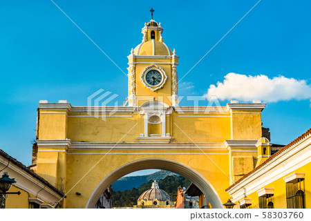 Arco de Santa Catalina and Volcan de Agua in Antigua Guatemala, Central America 58303760