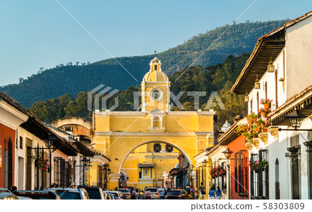 Arco de Santa Catalina and Volcan de Agua in Antigua Guatemala, Central America 58303809