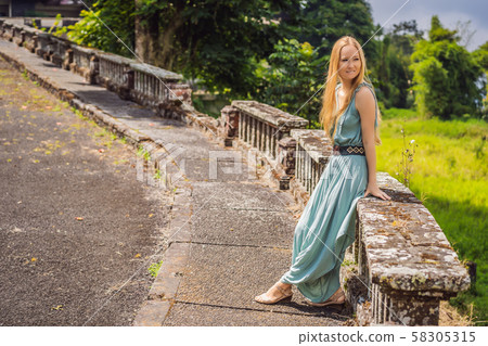 Woman tourist in abandoned and mysterious hotel in Bedugul. Indonesia, Bali Island. Bali Travel Woman tourist in abandoned and mysterious hotel in Bedugul. Indonesia, Bali Island. Bali Travel 58305315
