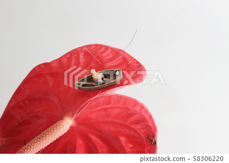 a mini figure is fishing on the Anthurium a mini figure is fishing on the Anthurium 58306220