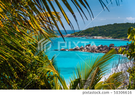 Coastline of La Digue island in Seychelles. Grand and Petite Anse paradise beaches with blue ocean Coastline of La Digue island in Seychelles. Grand and Petite Anse paradise beaches with blue ocean 58306616