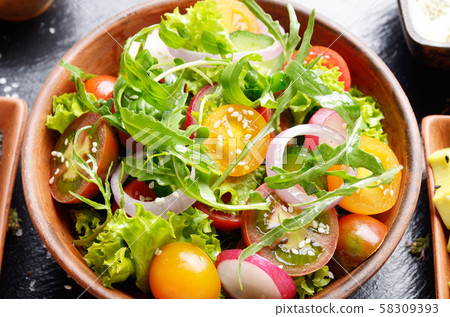 Top view at Clay dish with vegetable salad of 58309393