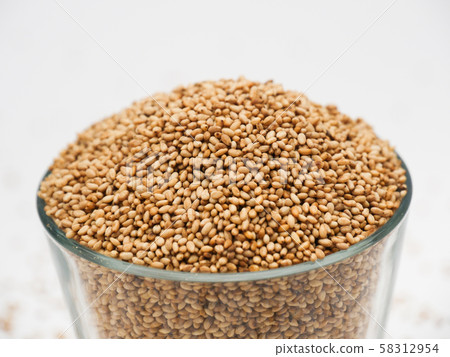 Toasted Sesame seeds in a glass cup Toasted Sesame seeds in a glass cup 58312954
