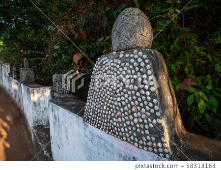 Monument  with  shells  near  Hinduism    Temple 58313163