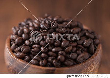 coffee beans. Black fresh roasted coffee beans.Peaberry coffee beans are a unique coffee bean that have a much richer flavor. coffee beans. Black fresh roasted coffee beans.Peaberry coffee beans are a unique coffee bean that have a much richer flavor. 58313393