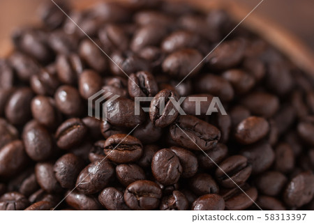 coffee beans. Black fresh roasted coffee beans.Peaberry coffee beans are a unique coffee bean that have a much richer flavor.  58313397