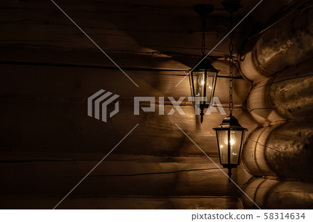 the old lamp shines with a soft warm light in the 58314634