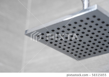 Square shower head in a modern bathroom. Shower in the bathroom with water spray or water. Feel 58315855