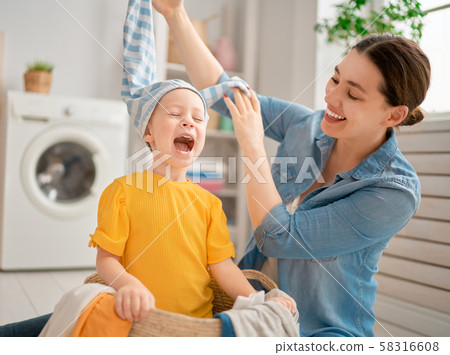 family doing laundry family doing laundry 58316608