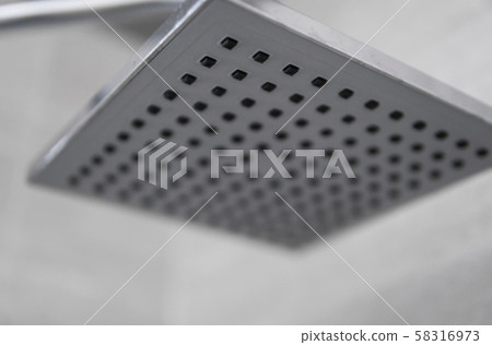 Square shower head in a modern bathroom. Shower in the bathroom with water spray or water. Feel Square shower head in a modern bathroom. Shower in the bathroom with water spray or water. Feel 58316973