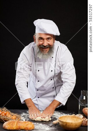 Smiling Senior Chef Baking Bread Smiling Senior Chef Baking Bread 58317297