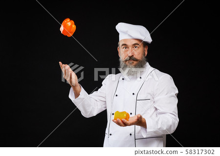 Senior Chef Juggling Vegetables Senior Chef Juggling Vegetables 58317302