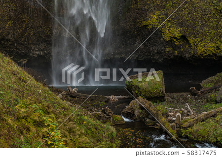Lower part of the first level of the Multnomah waterfall located at Multnomah Creek in the Columbia Lower part of the first level of the Multnomah waterfall located at Multnomah Creek in the Columbia 58317475