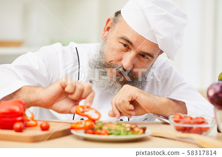 Chef Plating Dish in Restaurant Chef Plating Dish in Restaurant 58317814