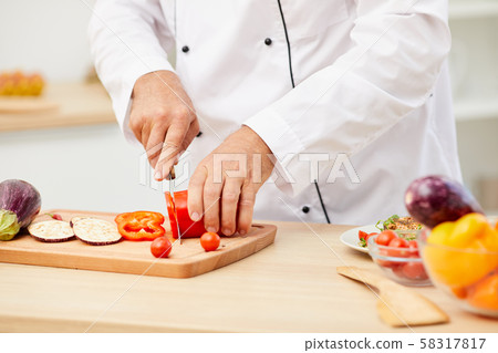 Chef Cutting Vegetables Closeup Chef Cutting Vegetables Closeup 58317817