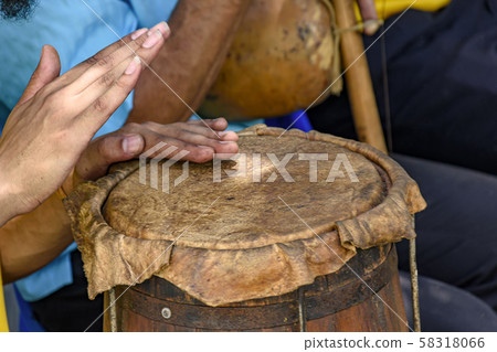 Brazilian woman hands playing ethnic drums in folk Brazilian woman hands playing ethnic drums in folk 58318066