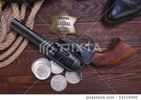 Old western gun with marshal badge and silver Old western gun with marshal badge and silver 58319400