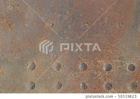 Picture of rusty iron sheet with rivets as background 58319623