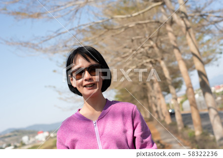 happy smiling asian woman happy smiling asian woman 58322236