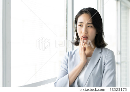 Worried business woman Worried business woman 58323173