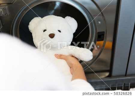 Single life concept, washing machines at laundromat 155 58326826