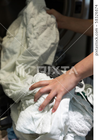 Single life concept, washing machines at laundromat 170 58326874