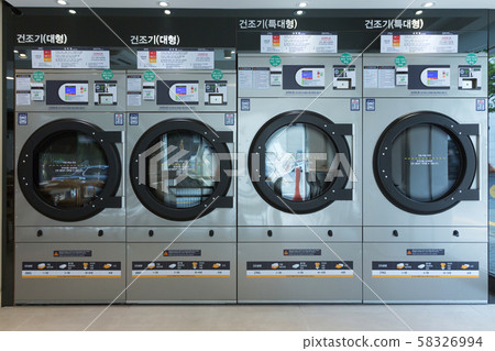 Single life concept, washing machines at laundromat 142 Single life concept, washing machines at laundromat 142 58326994