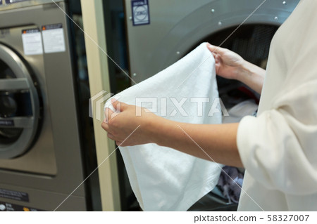 Single life concept, washing machines at laundromat 131 58327007