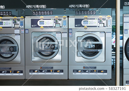 Single life concept, washing machines at laundromat 052 Single life concept, washing machines at laundromat 052 58327191