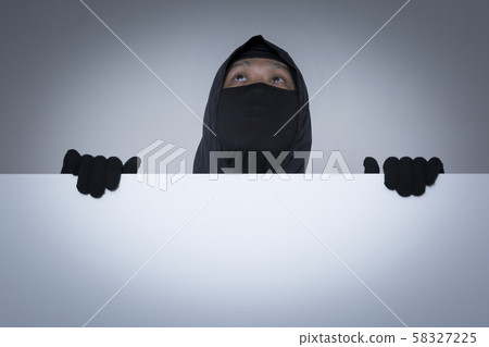 Criminal concept photo, Male Thief in Black Mask 089 Criminal concept photo, Male Thief in Black Mask 089 58327225