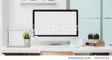 Blank screen desktop computer with office supplies Blank screen desktop computer with office supplies 58329729