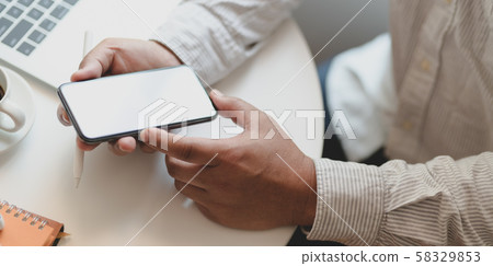 Businessman working on his project while using 58329853