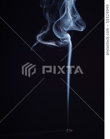 Abstract swirl of white smoke isolated on black 58329949