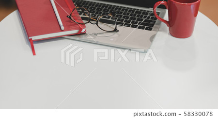 Cropped shot of trendy office with laptop computer 58330078