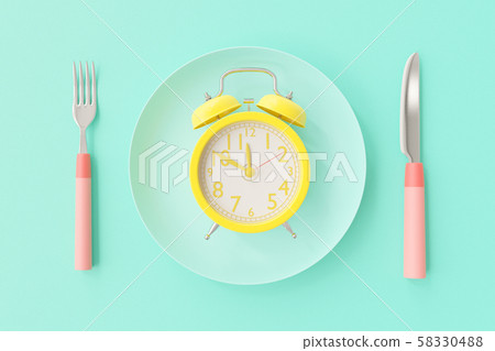 Yellow clock on the blue-green plate Yellow clock on the blue-green plate 58330488